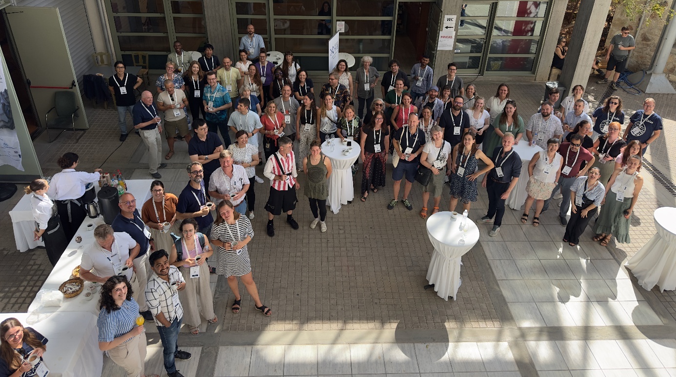 A group of people standing in a room AI-generated content may be incorrect.