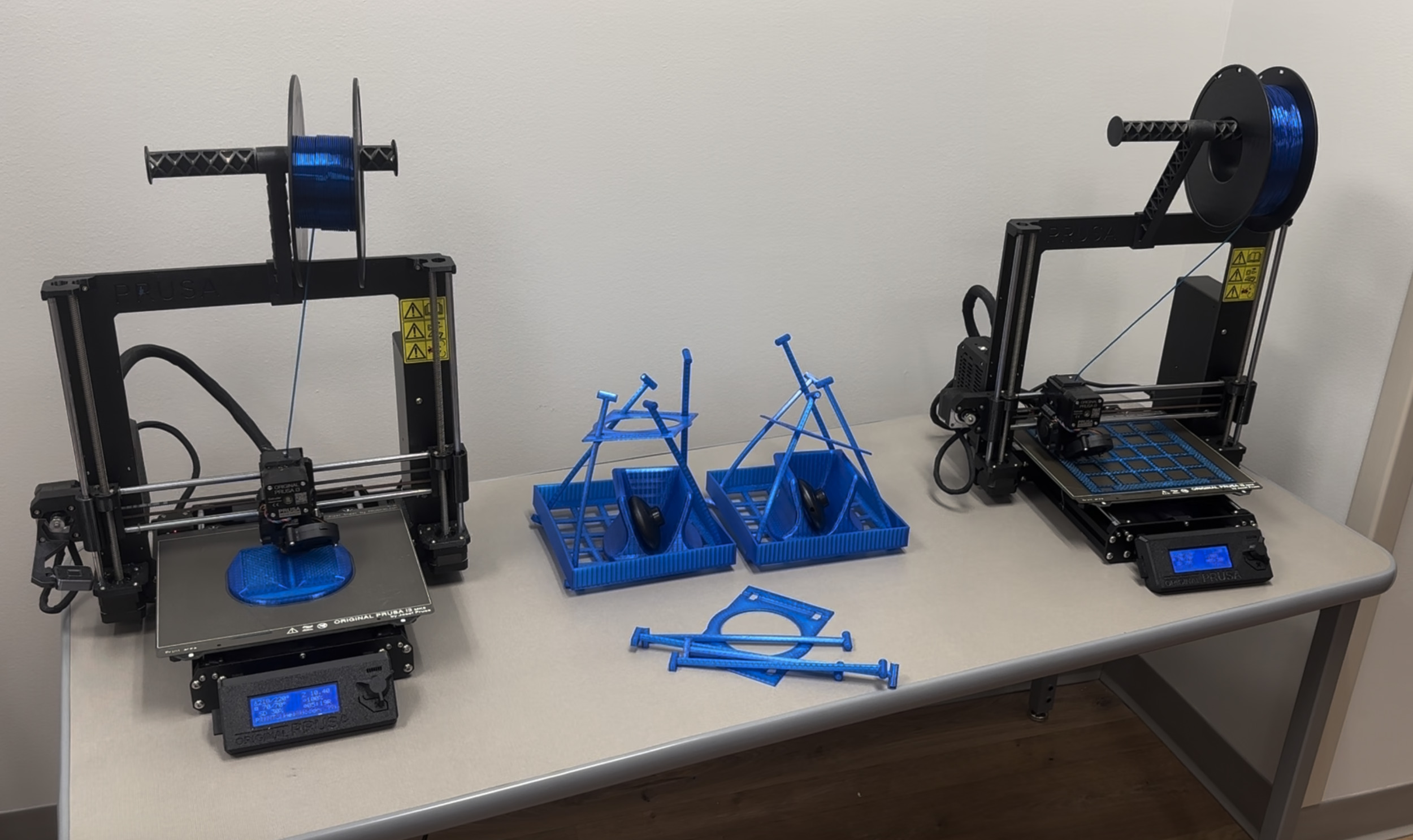 Several blue objects on a table AI-generated content may be incorrect.