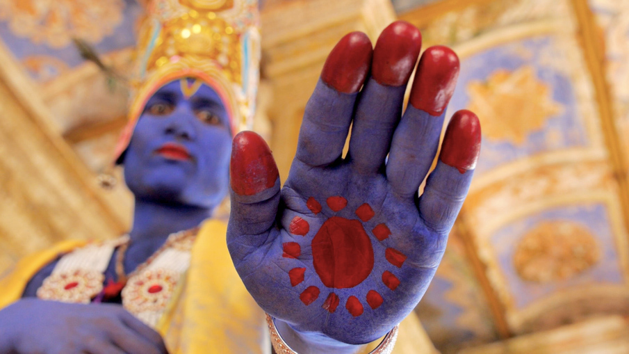 A person with painted hands AI-generated content may be incorrect.