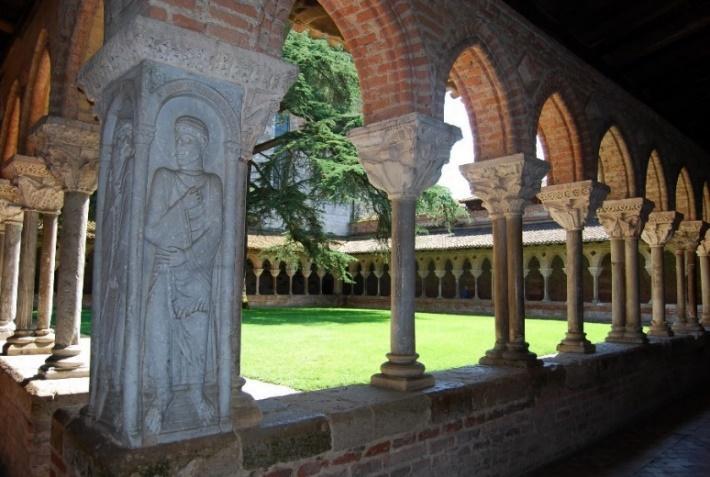 A stone statue in a courtyard AI-generated content may be incorrect.