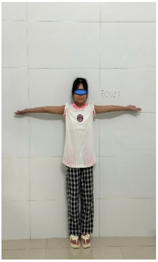 A person standing with her arms out AI-generated content may be incorrect.