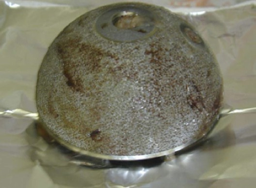 A round metal object with holes AI-generated content may be incorrect.