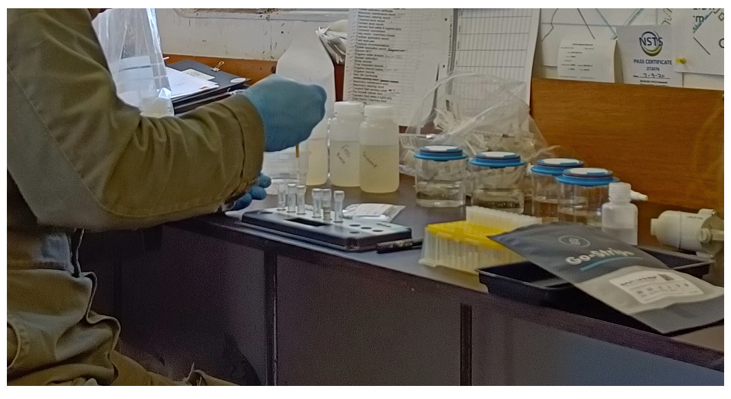 Picture of end-user performing testing for E. coli in irrigation water sources on-site.