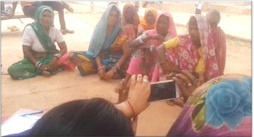 A group of women sitting on the ground AI-generated content may be incorrect.