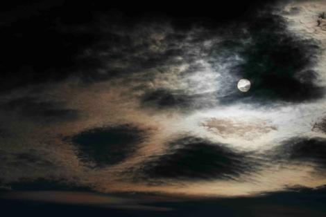 A moon in the sky AI-generated content may be incorrect.