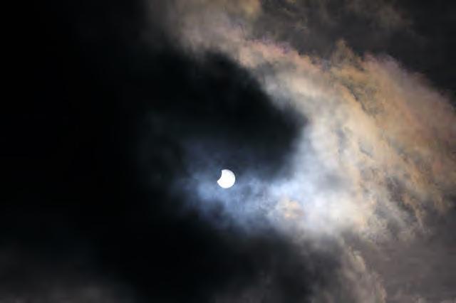 A moon in the sky Description automatically generated