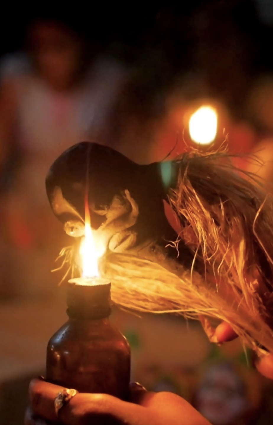 A person lighting a candle AI-generated content may be incorrect.