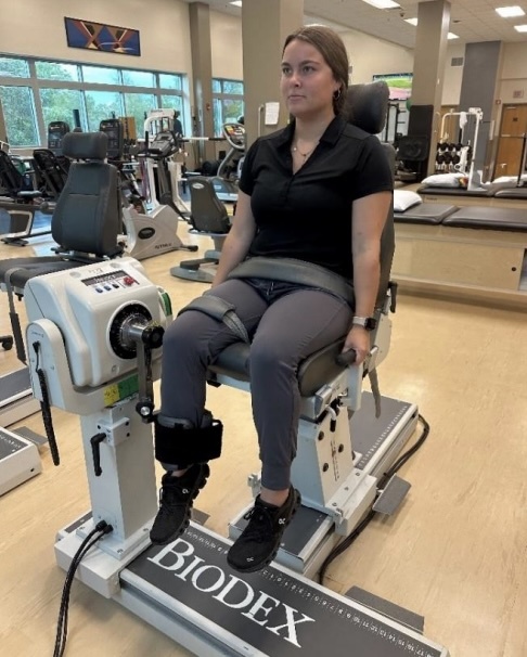 A person sitting on a machine AI-generated content may be incorrect.