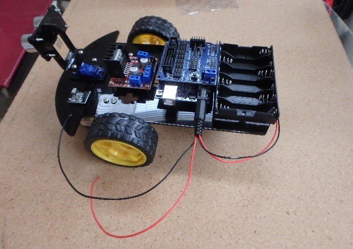 A picture containing indoor, table, sitting, computer Description automatically generated