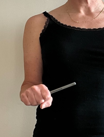 A person holding a pen AI-generated content may be incorrect.