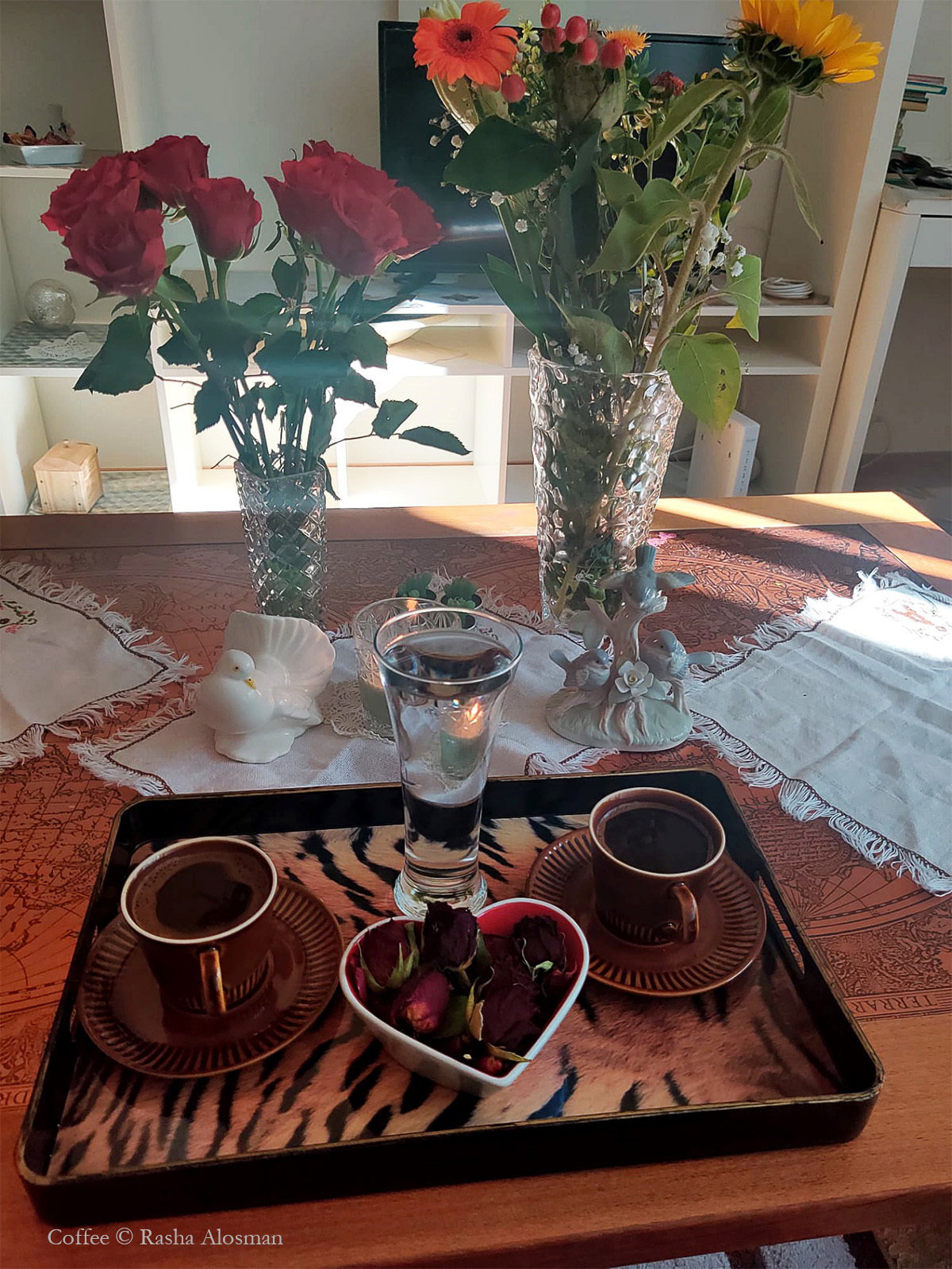 A tray with cups of coffee and flowers on it AI-generated content may be incorrect.