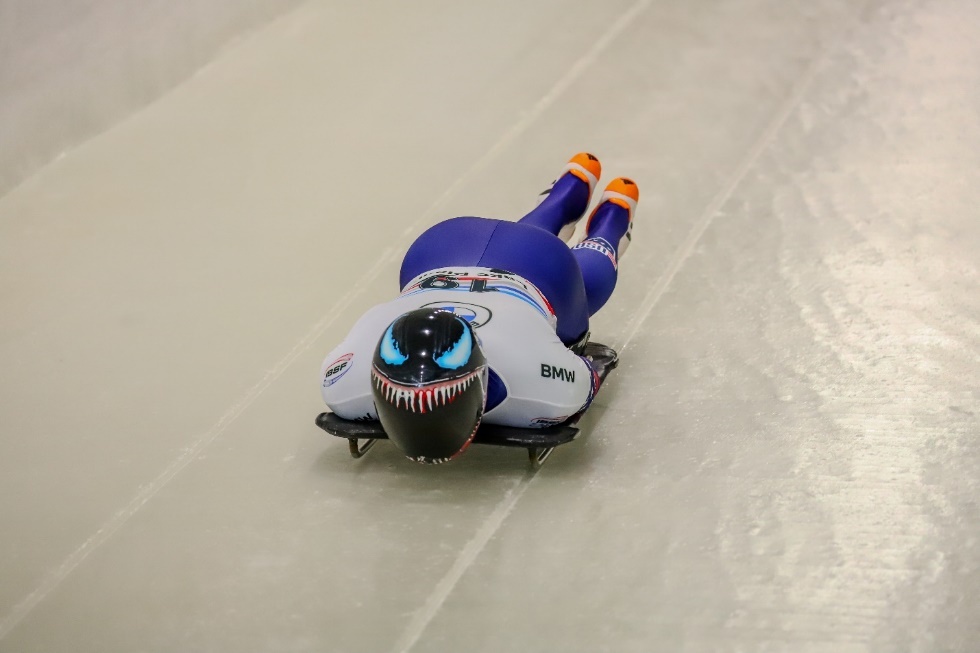 A person on a sled Description automatically generated