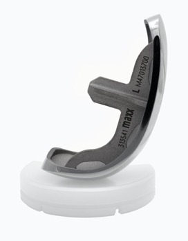 A white high heel shoe Description automatically generated with low confidence