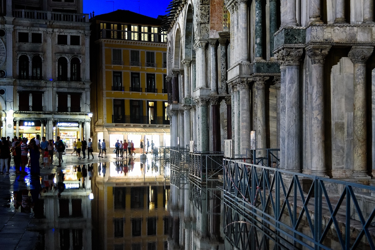 A reflection of a building in a puddle AI-generated content may be incorrect.