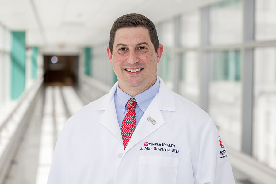 A person in a white coat AI-generated content may be incorrect.