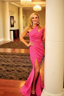 A person in a pink dress Description automatically generated