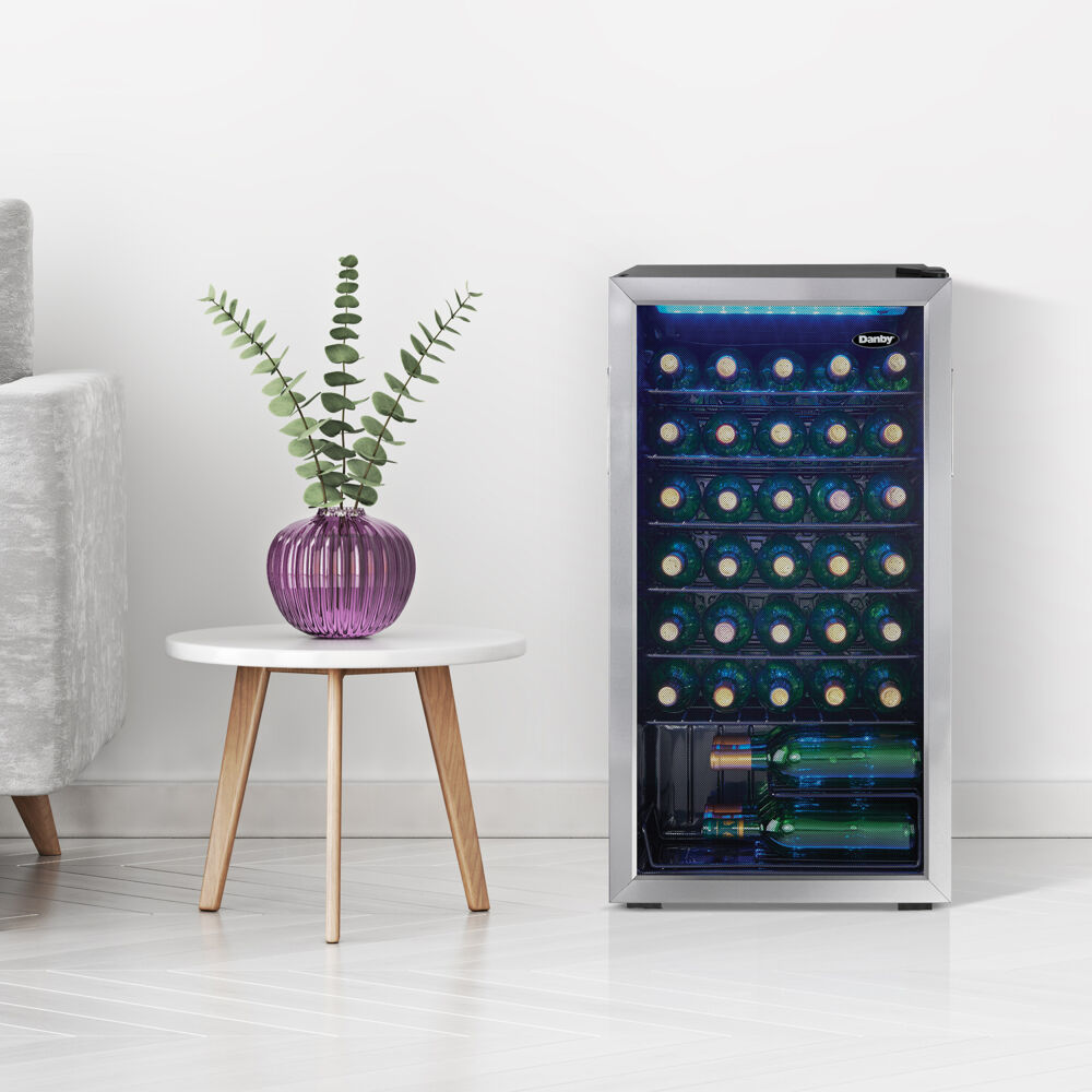 Model: DWC036A1BSSDB-6 | Danby 36 Bottle Wine Cooler, Interior Blue LED Lighting, Wire Shelves