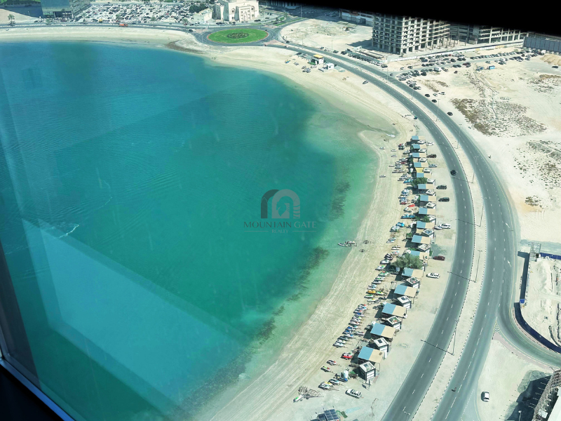 Wake Up to Panoramic Sea Views at La Plage Tower 2BR Al Mamzar - Sharjah Mountain Gate