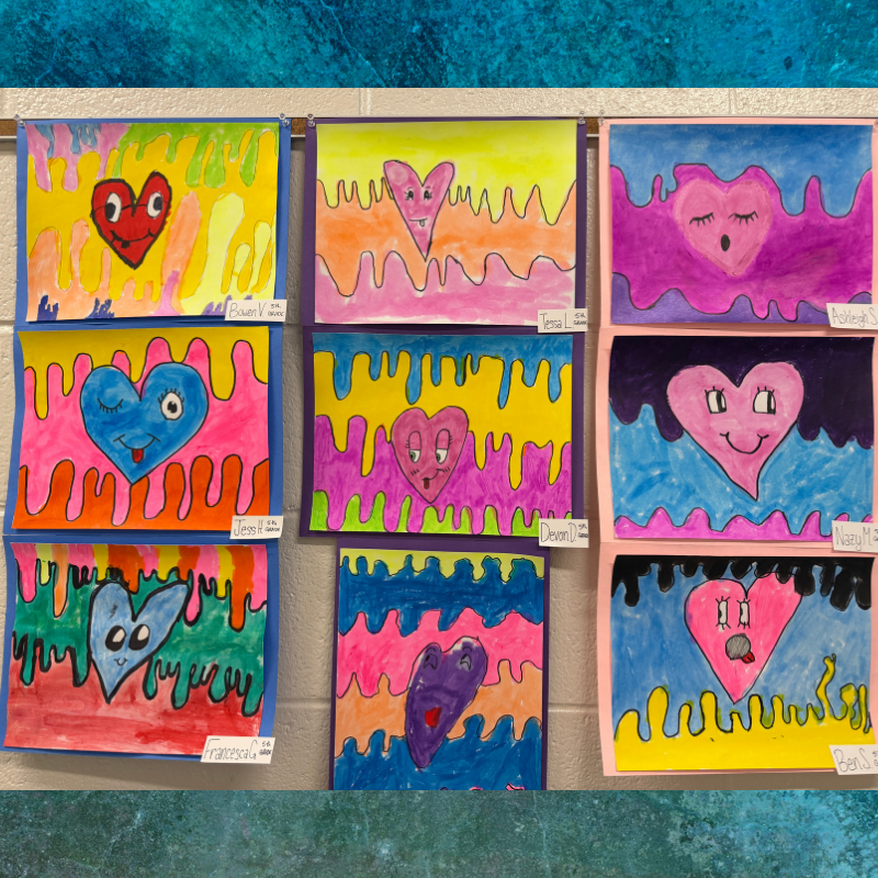 A colorful display of children's artwork featuring various heart designs with expressive faces.