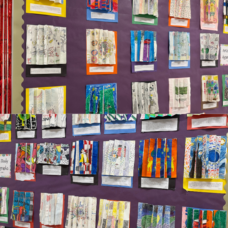 A wall display showcases numerous colorful, accordion-folded art projects created by students.