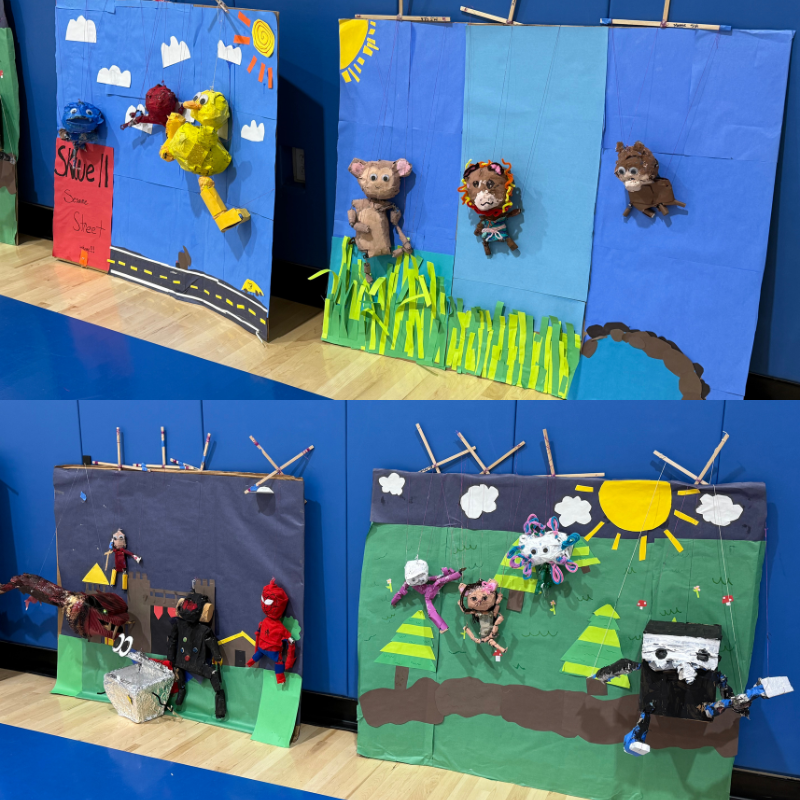 Four colorful puppet show scenes are displayed, each with handmade puppets and painted backdrops.