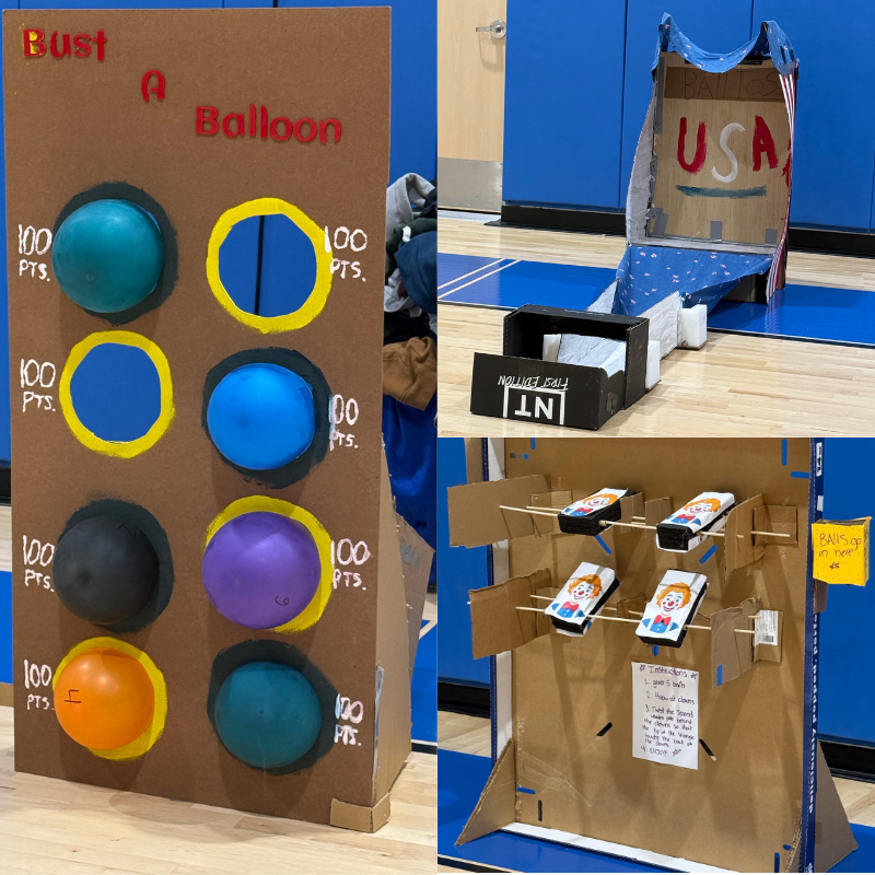 A 'Bust A Balloon' game with colorful balloons and point values displayed on a cardboard stand.