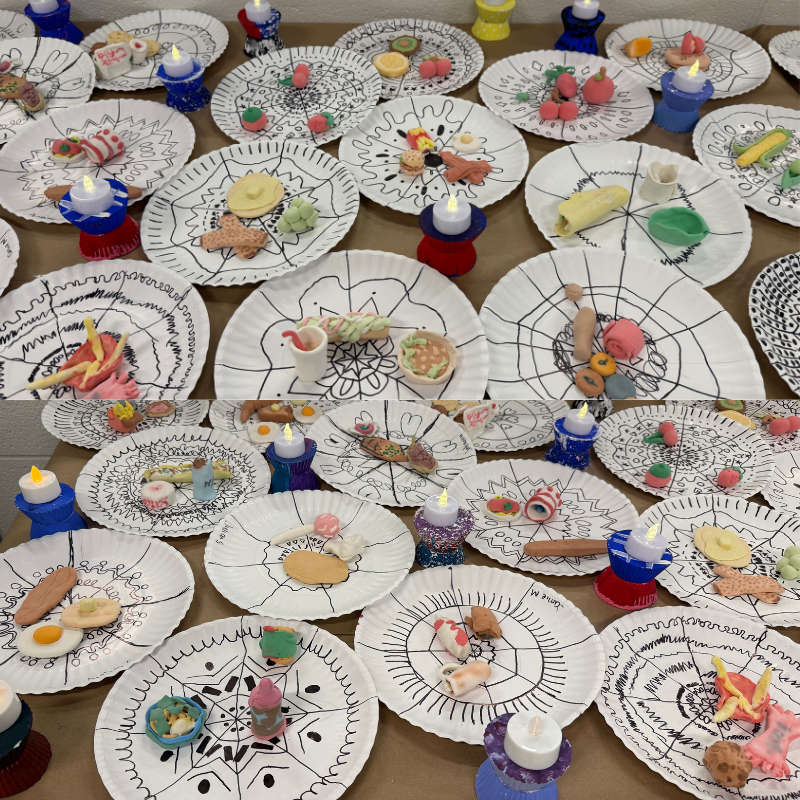A collection of paper plates decorated with mandala designs and adorned with small, colorful clay food items and LED candles.