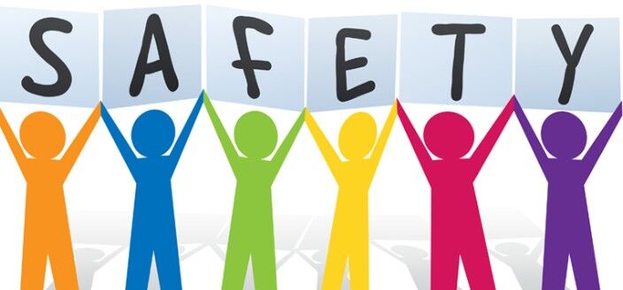 Six colorful stick figures hold up signs spelling the word SAFETY.