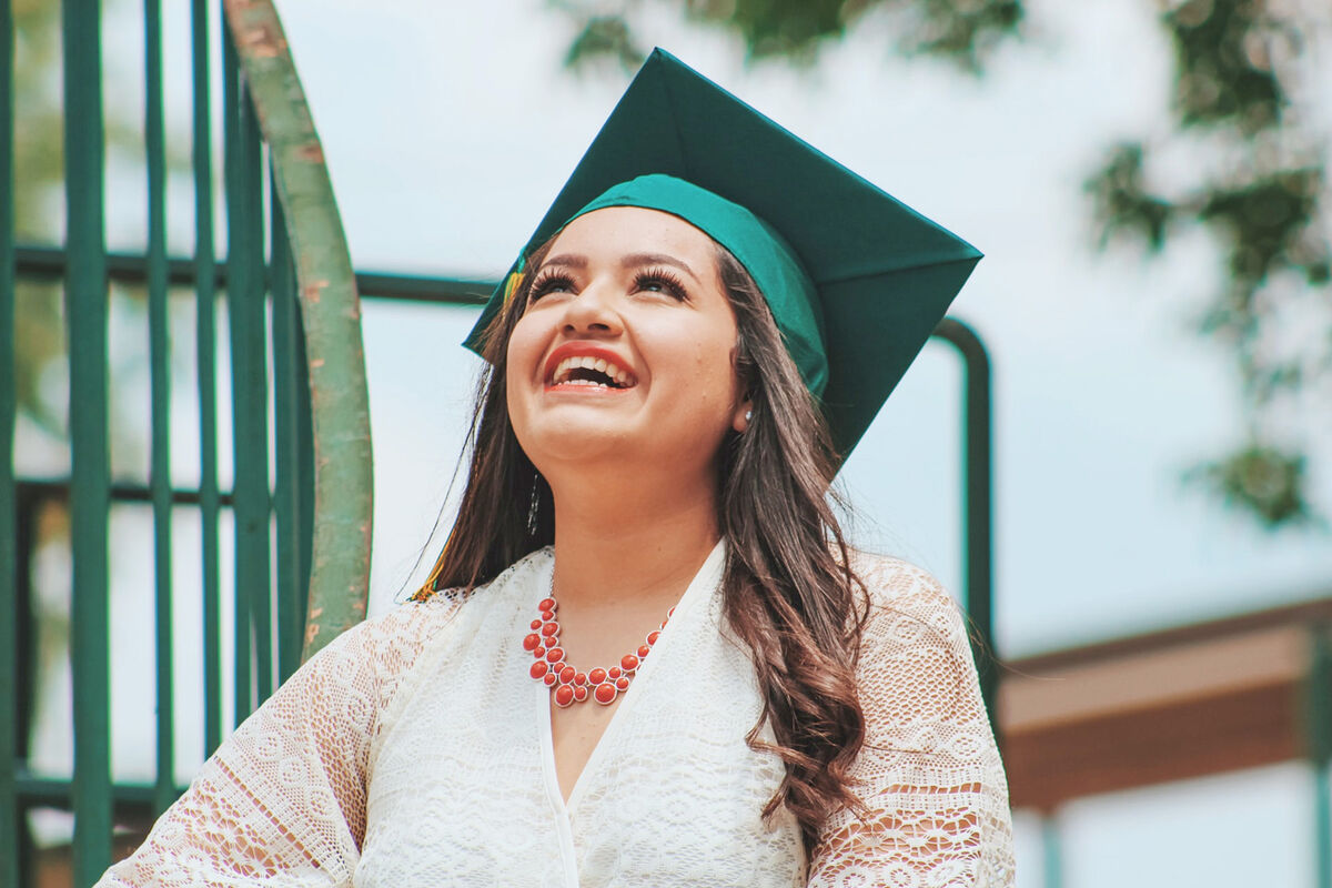 graduate smiling and looking up