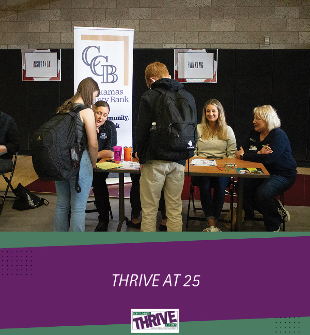 Students at the banking table during Thrive at 25