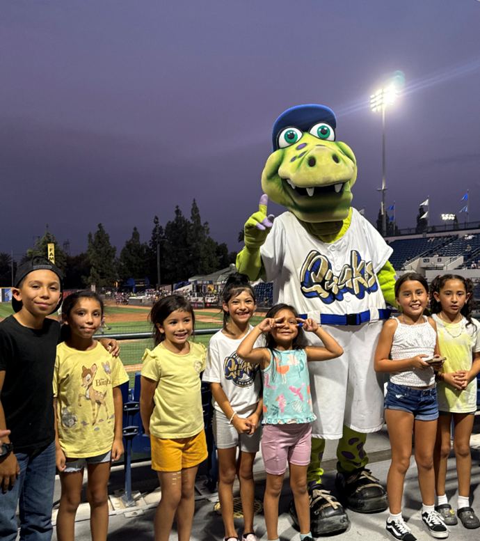 Image of CES students with Quakes mascot at the Quakes stadium.