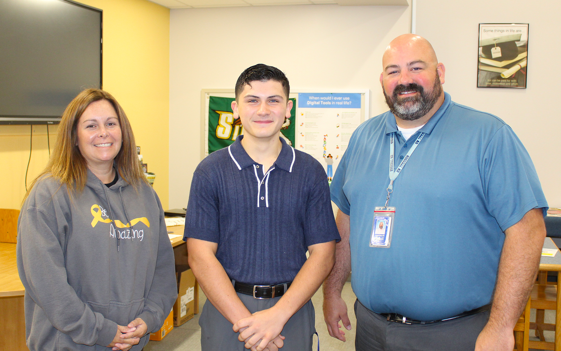 Three smiling adults