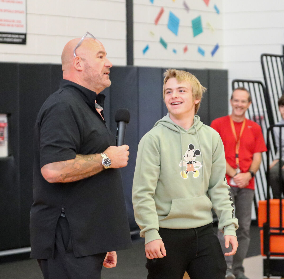 Motivational speaker Jeff Yalden talks to an Emerson J. Dillon Middle School student about putting in his best effort.