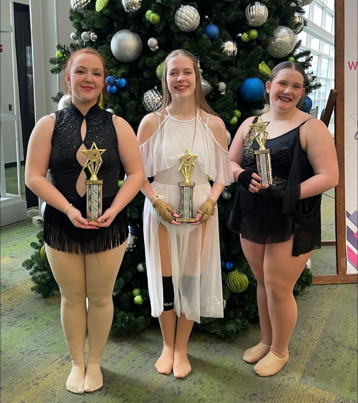 photo of guard soloist Caitlin Austin, Rhianna Weems and Olivia Fox who placed, 6th, 5th and 4th respectively at state guard