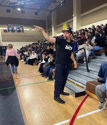 Image of RCMS' student assembly with Dr. Blake.