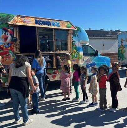 Image of students patiently waiting in line to get their Kona Ice treat.