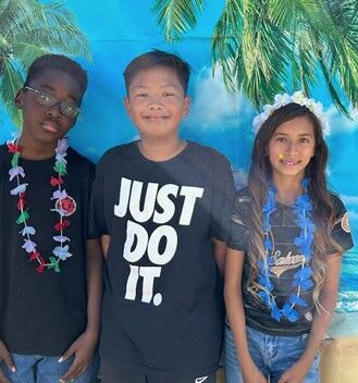 Image of students in their luau-themed attire.