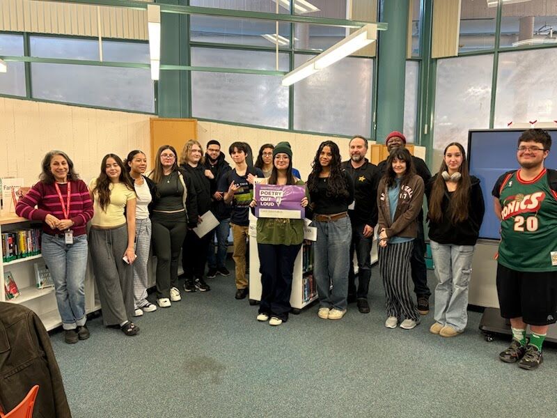 Students pose with visitors.