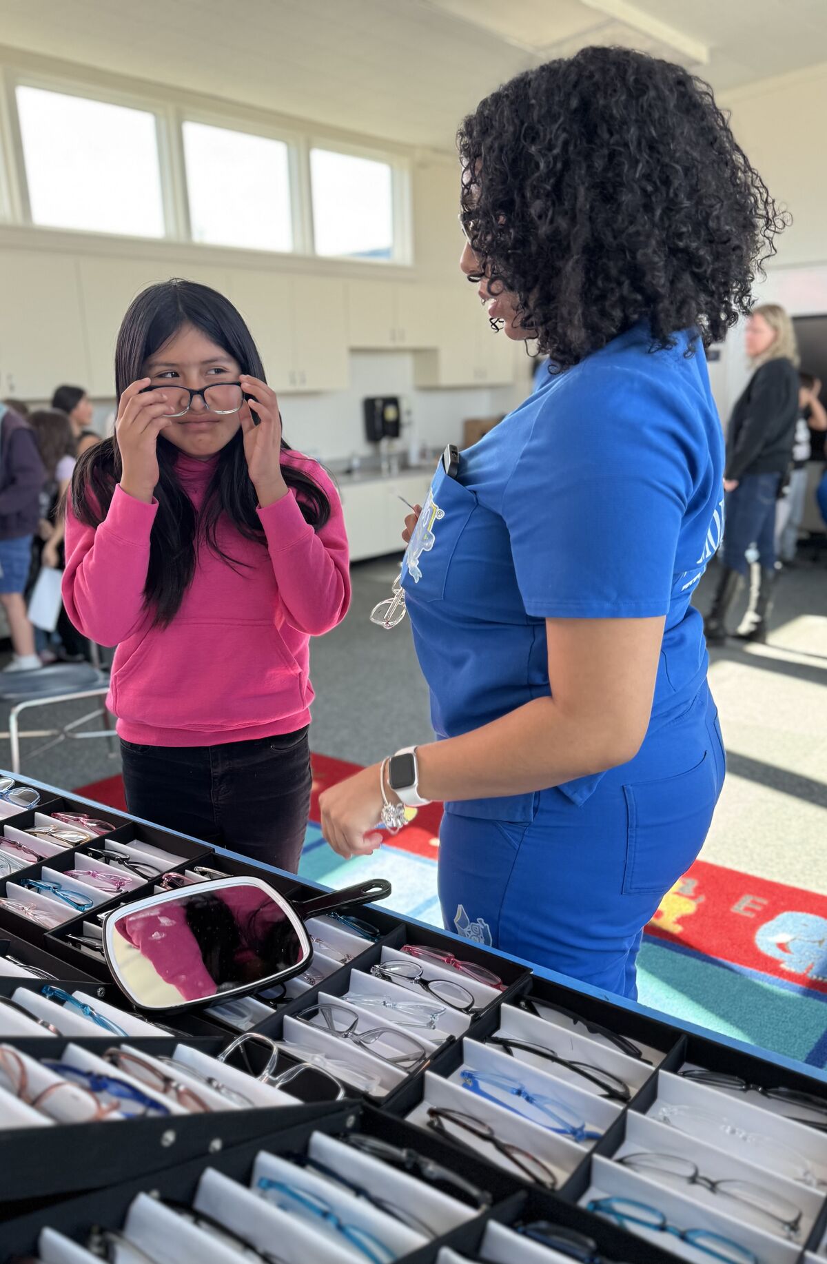Girl trying on glasses