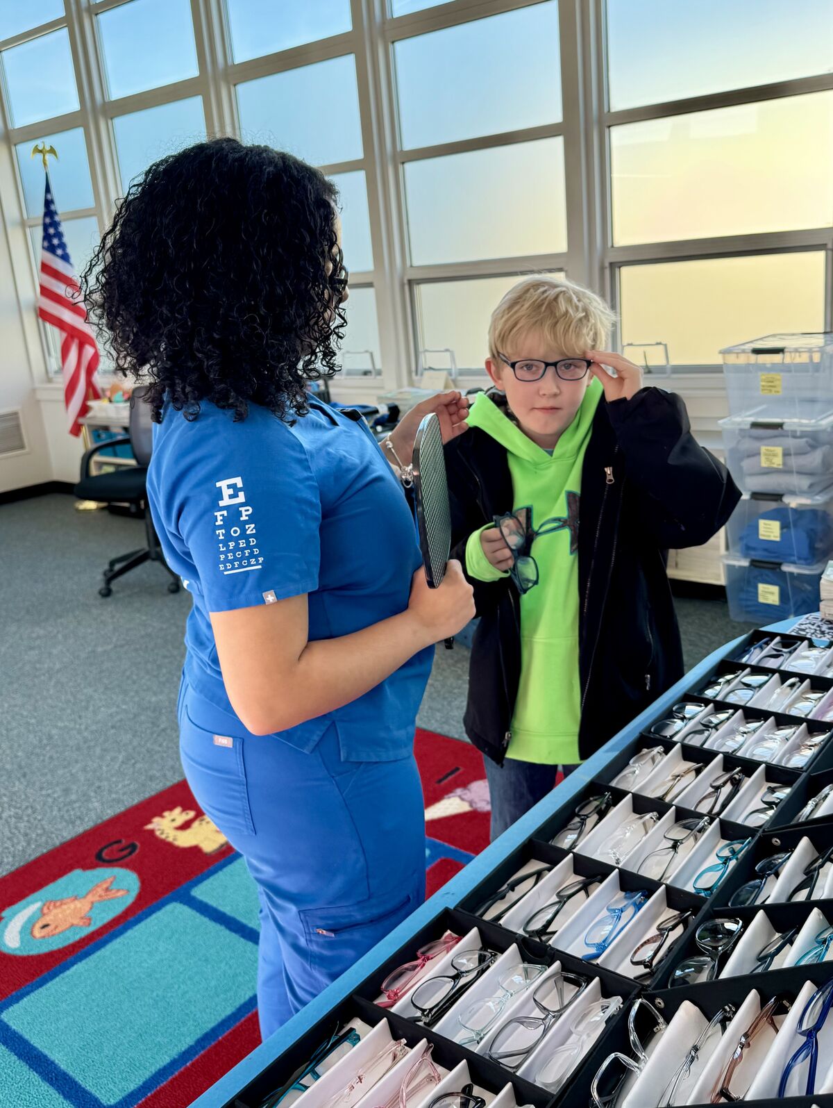 boy trying on glasses