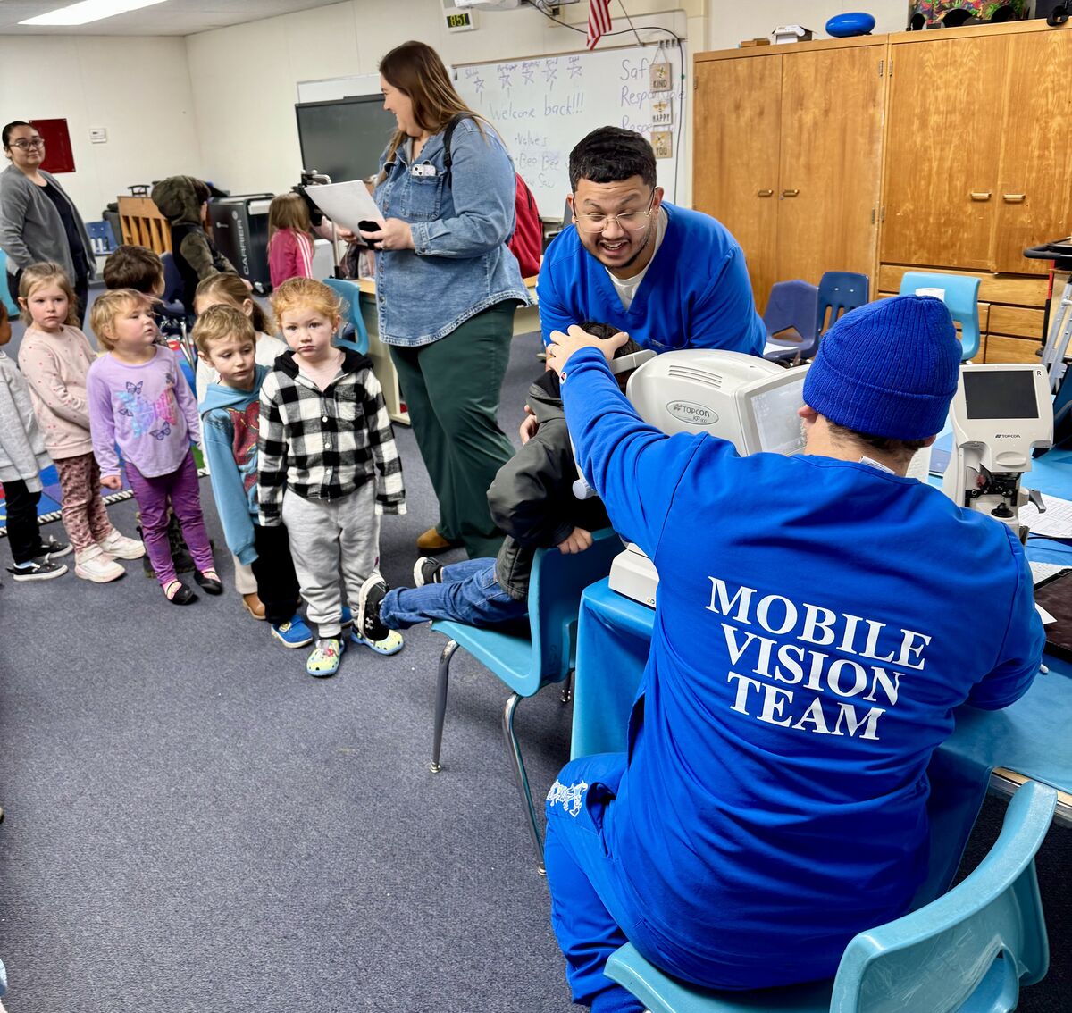 Kids in line to get an eye exam