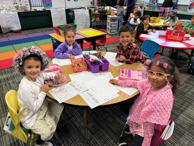 Image of a classroom full of students dressed in costumes inspired by senior citizens.