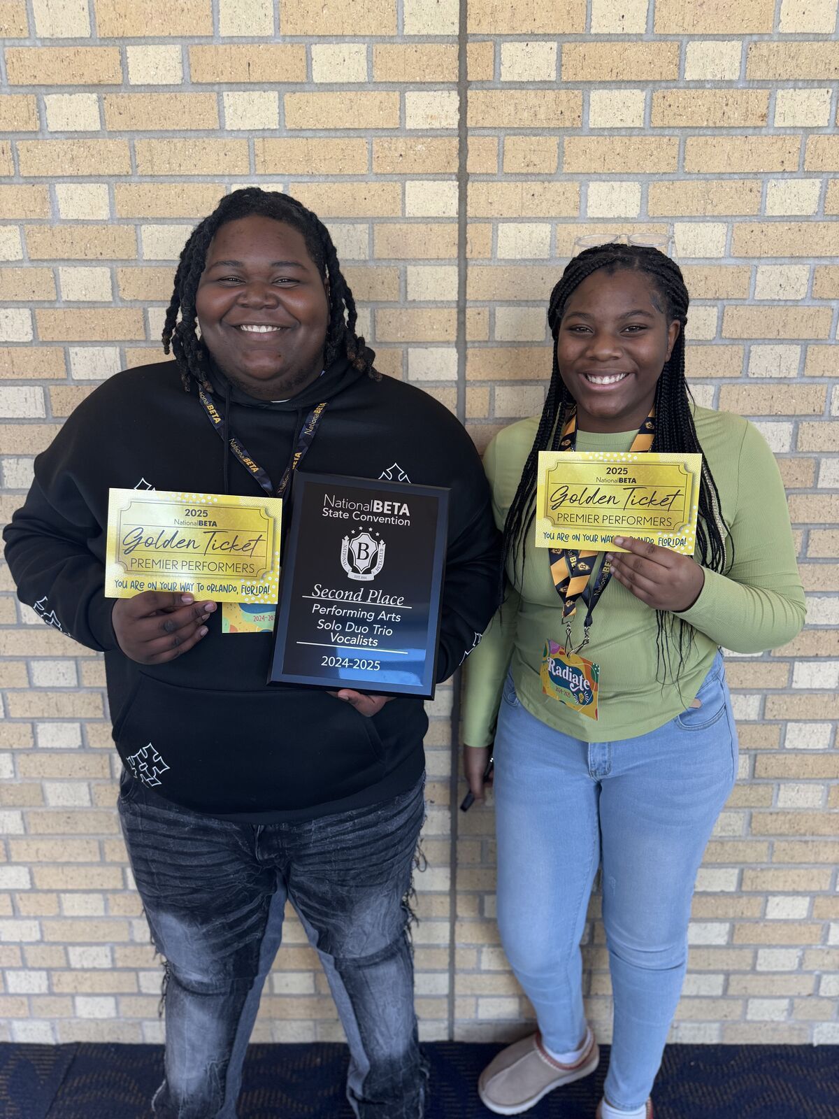 Students holding awards