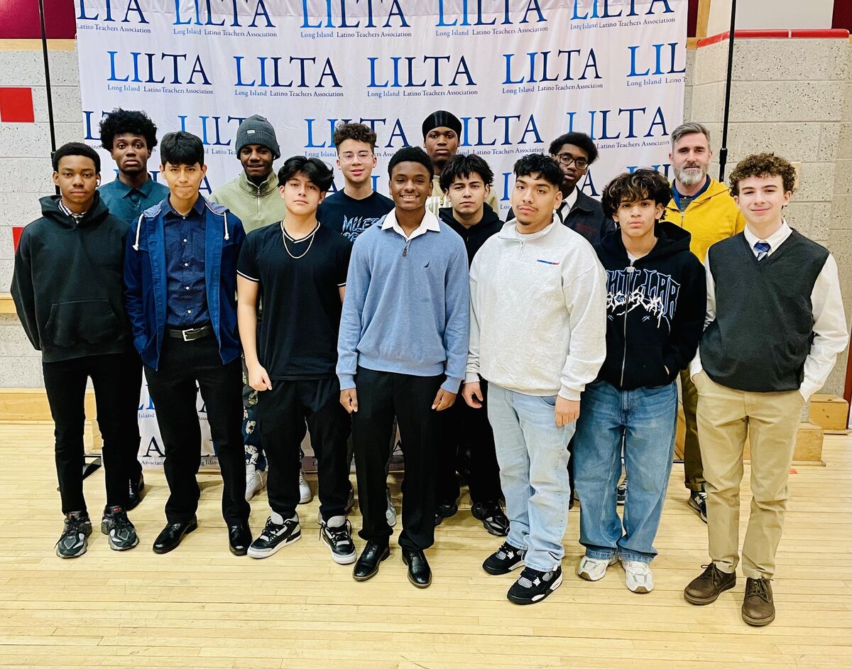 Student group phot in front of LILTA banner.