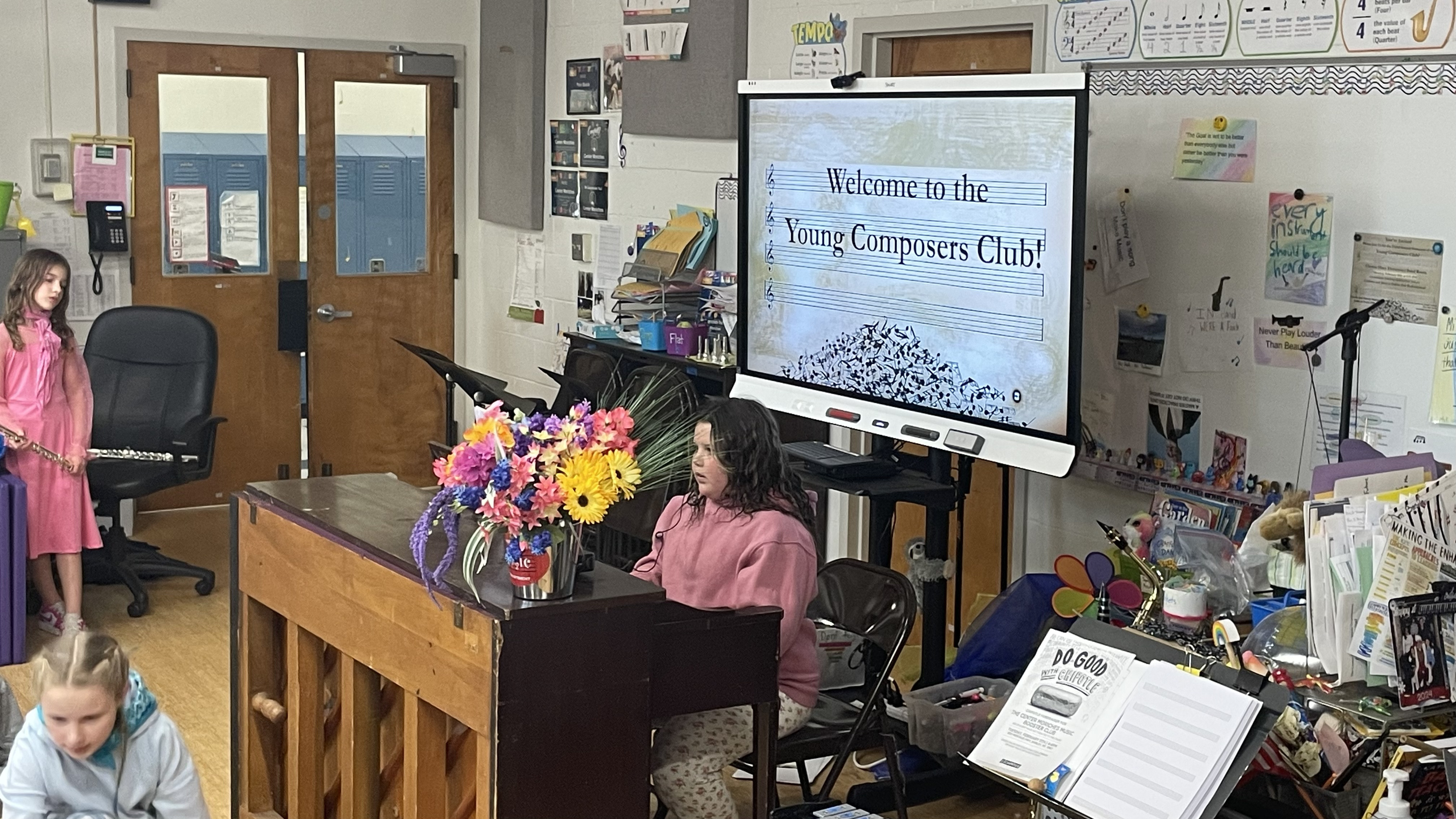 A student playing piano at the Young Composers Showcase