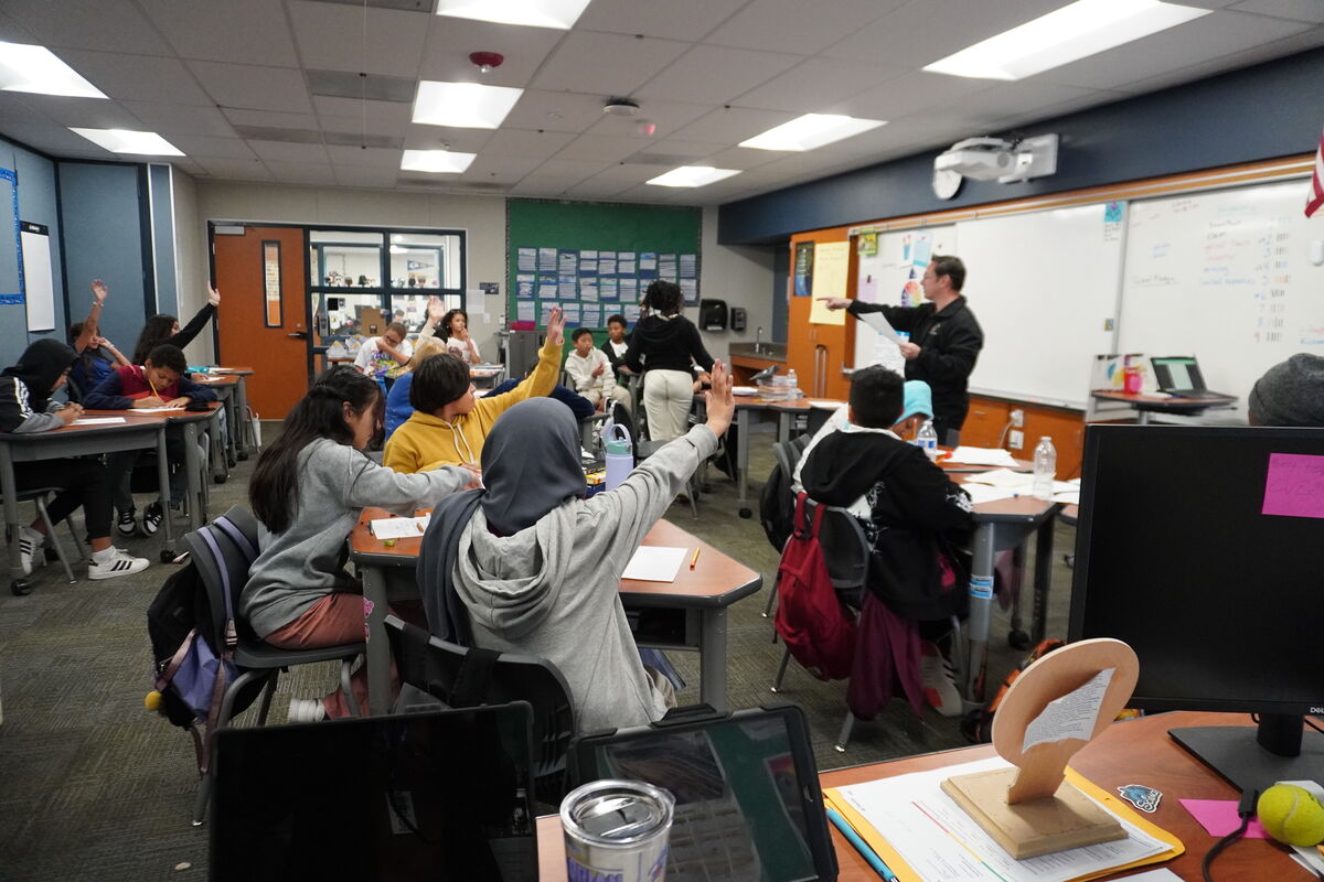 Image of Dr. Chaix, Superintendent, teaching in a 5th grade classroom.