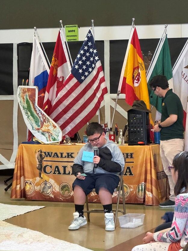 Image of a Los Amigos Walk Through California student presentation.