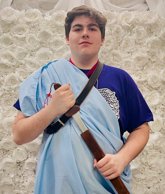student wearing toga with sword