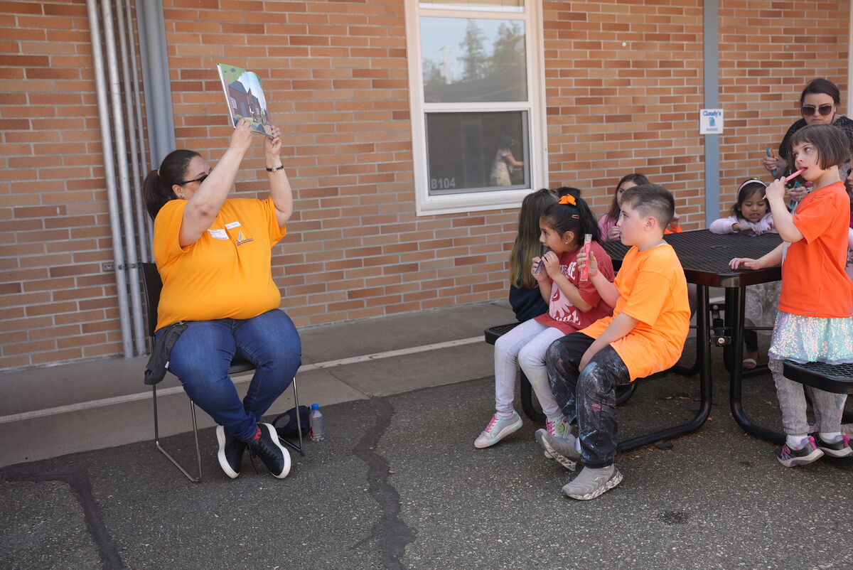 city employee reading to students