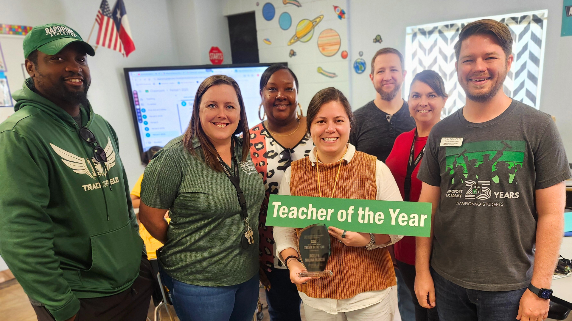 Ms Mancio accepts the Teacher of the Year award